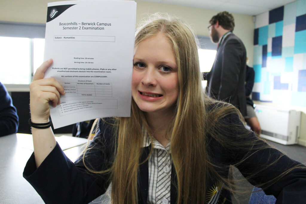 Girl holding exam paper